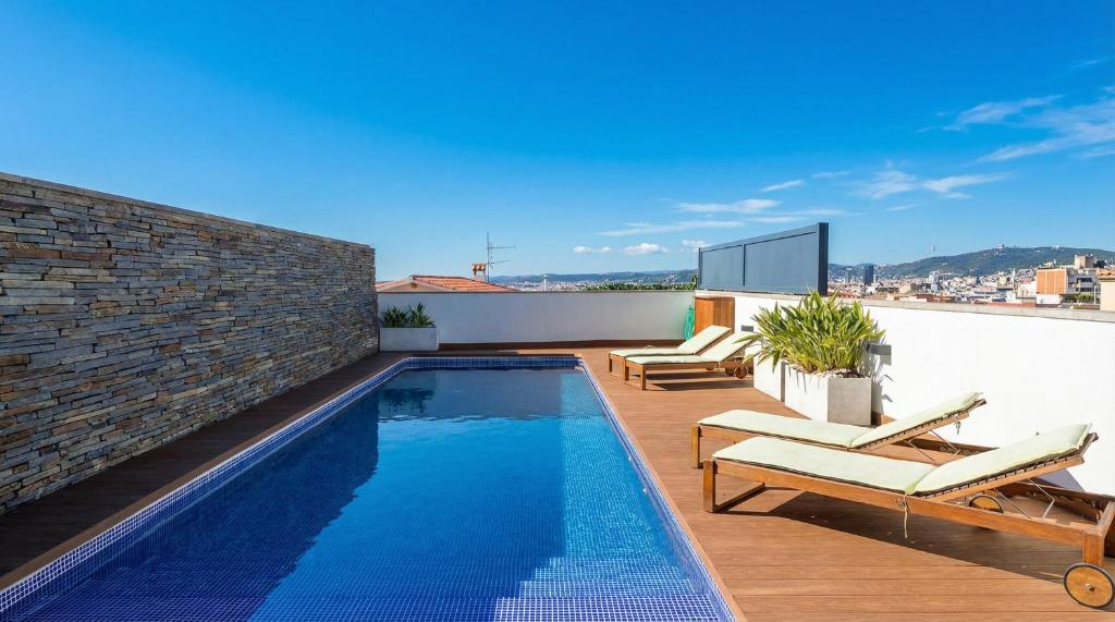 a swimming pool on the roof of a house at Villa Kala in Sant Pere de Ribes