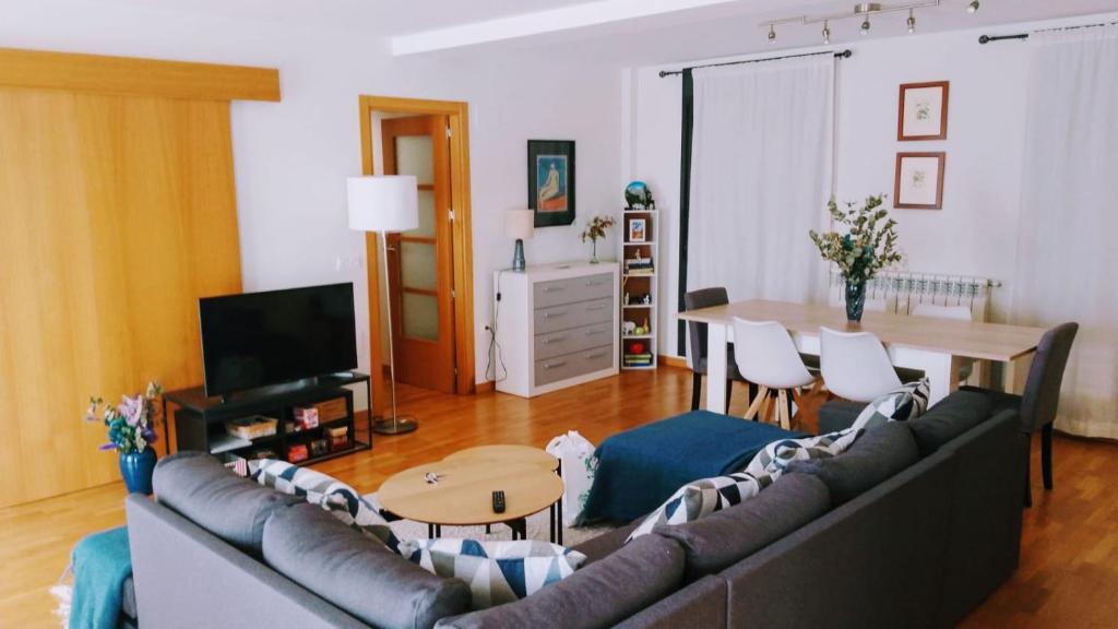 a living room with a couch and a table at El Rincón del Ángel in Jaca
