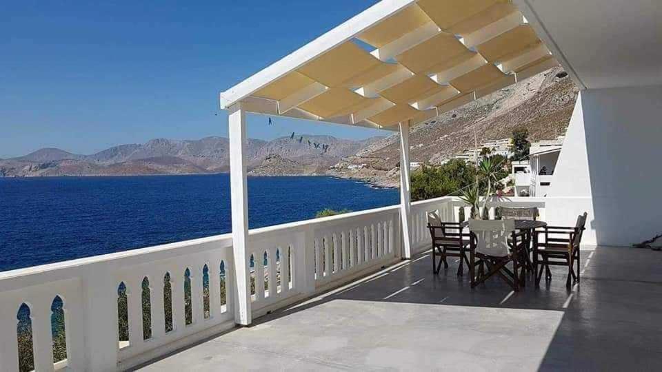 a balcony with a view of the ocean at Louis Studios Armeos in Masouri