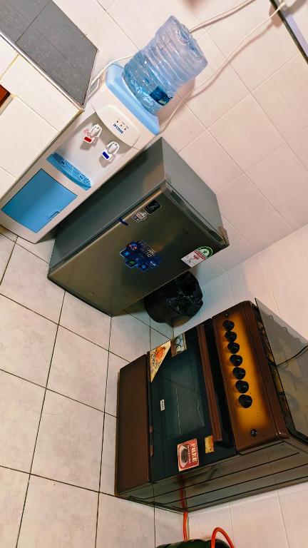 an overhead view of a kitchen with a refrigerator at Shima Complex in Nakuru