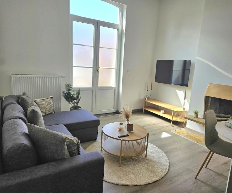 a living room with a couch and a table at Atomium Apartment 1 in Brussels