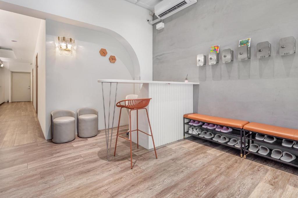 a room with a bar with a stool in it at Wuyu in Tainan