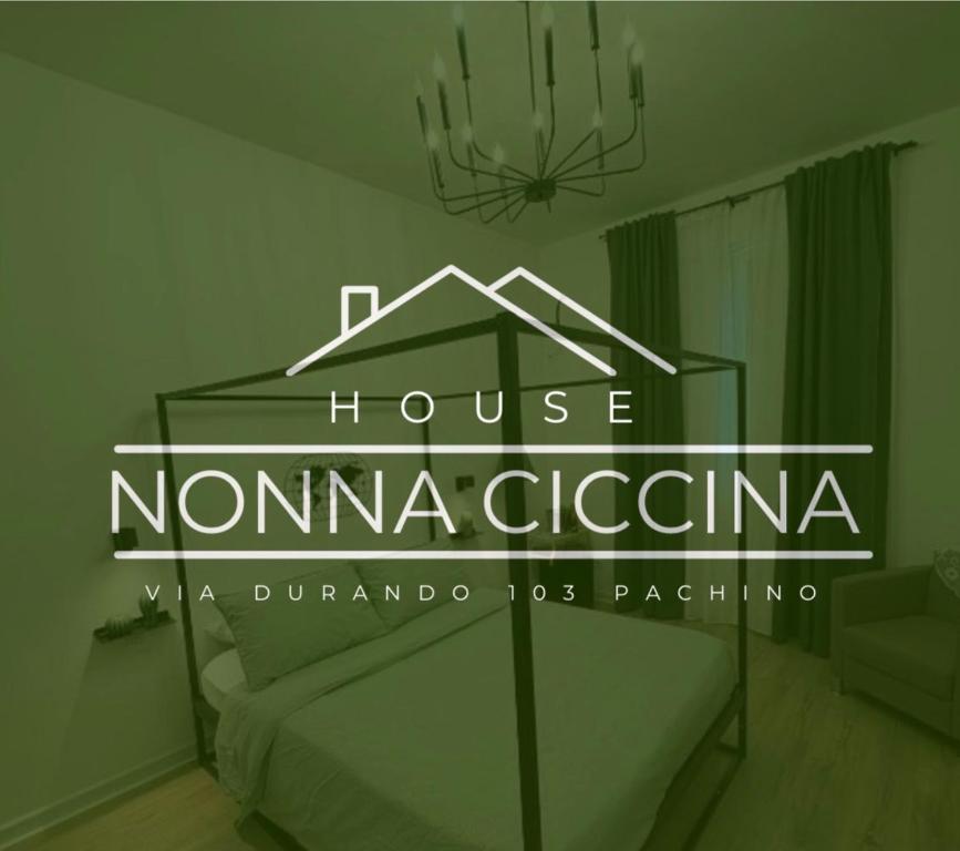 a house noma coda sign in a room at Nonna Ciccina House in Pachino