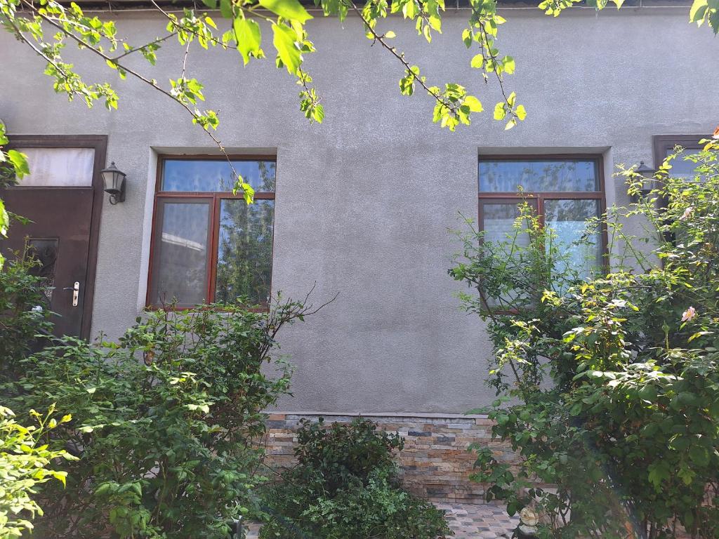 a building with three windows on the side of it at сой333 in Navoi
