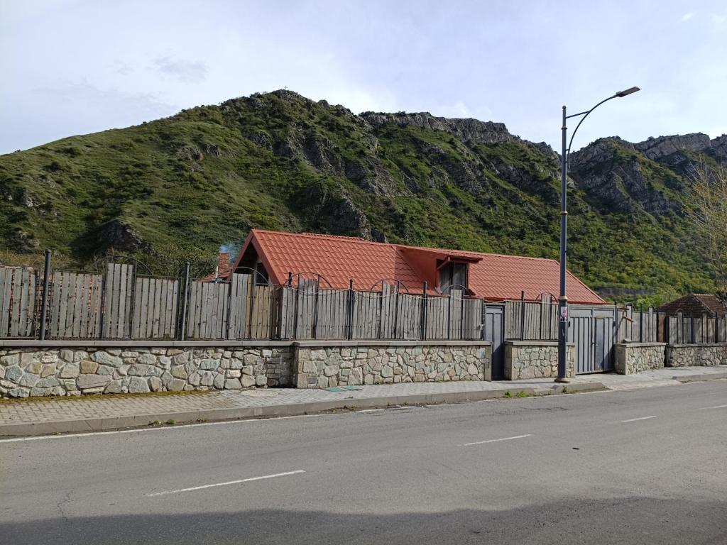 a fence on the side of a road with a house at Agmashenebeli house 3 in Mtskheta