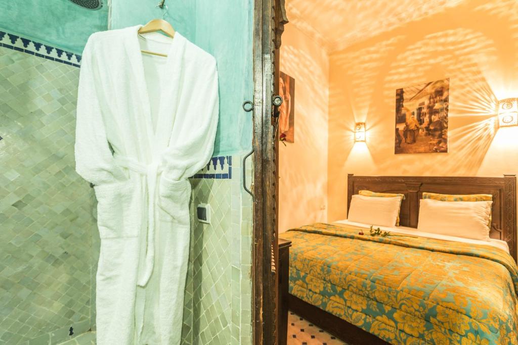 Postel nebo postele na pokoji v ubytování Riad Nasreen