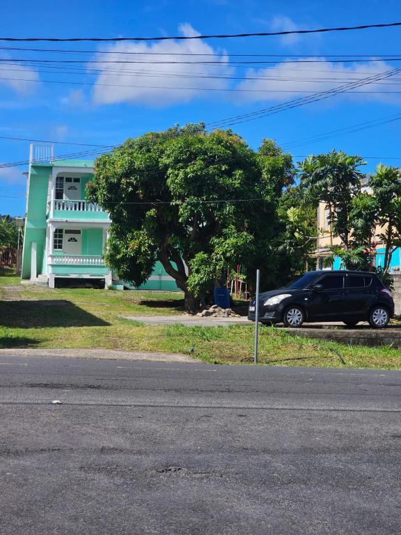 a black van parked in front of a house at mango suites in Portsmouth