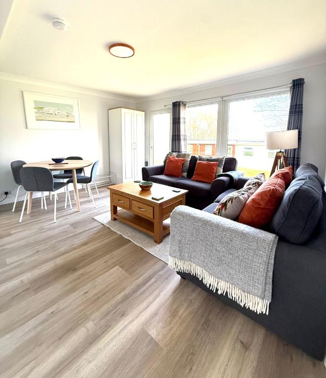 a living room with a couch and a table at 51 Norton Park in Dartmouth