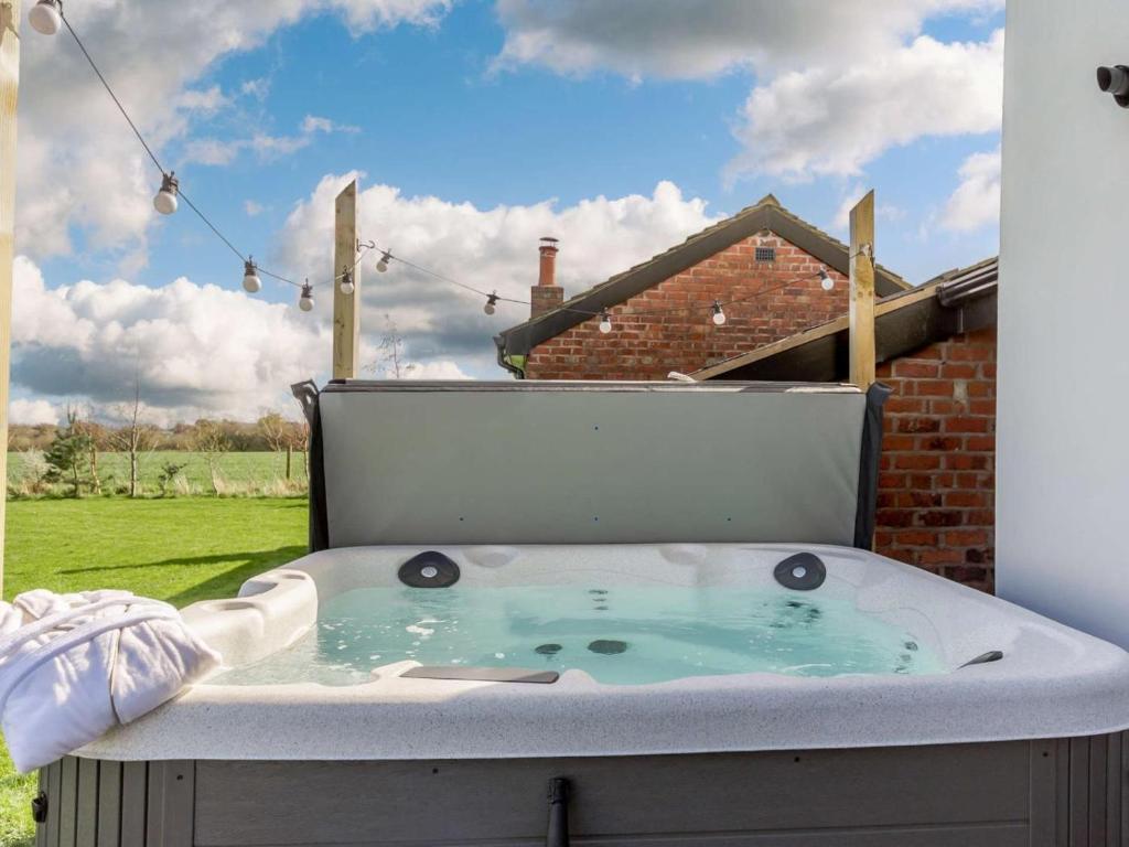 a hot tub in the backyard of a house at 2 Bed in Ormskirk oc-90263 in Barton
