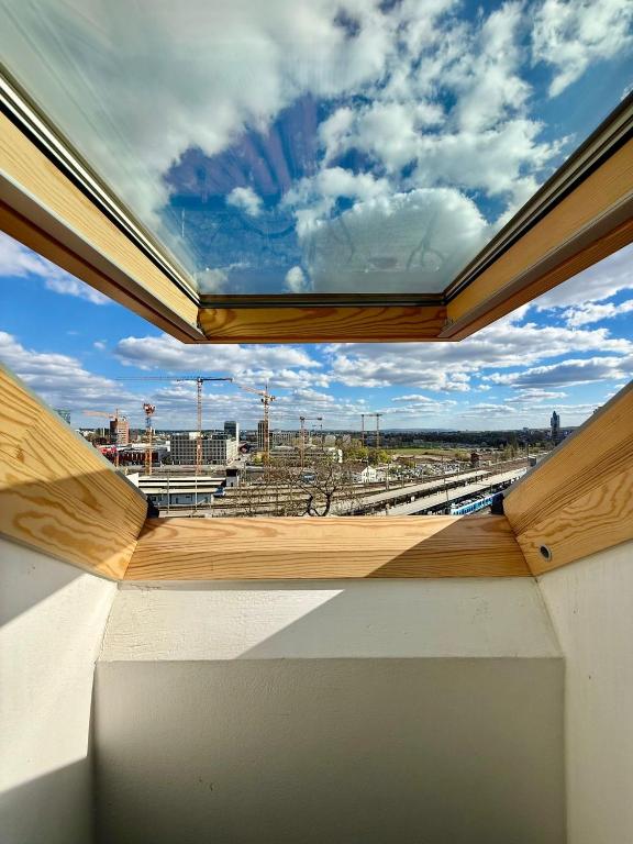 a room with a view of a train station from a window at Stay In Centre in Brno