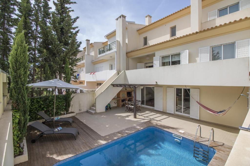 an aerial view of a house with a swimming pool at Casa Oliveira by Algarve Holidays in Loulé