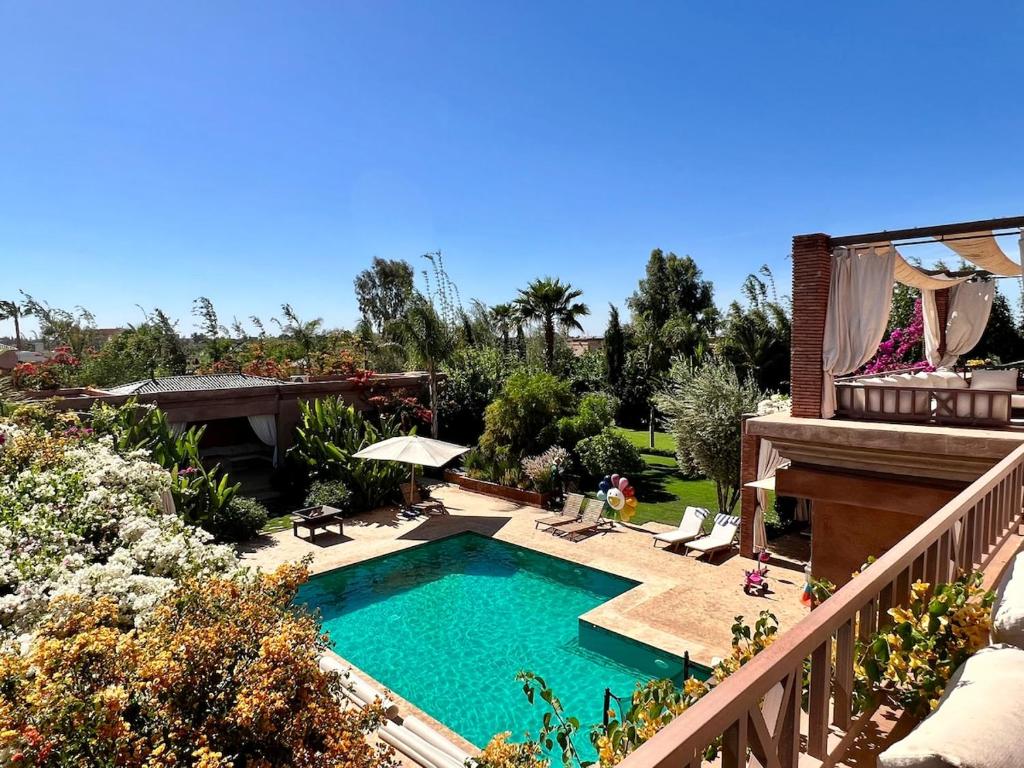 a swimming pool in the backyard of a house at Villa Socar - Heated pool - Padel - Marrakech in Najem