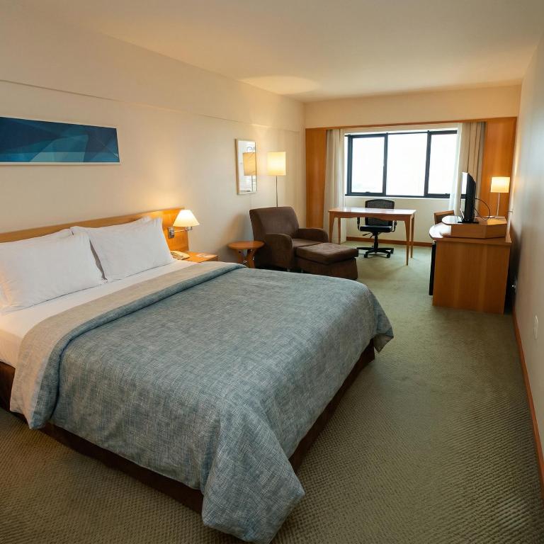 a hotel room with a bed and a desk at 1601 - Hotel & Residence Sol Alphaville Flat in Barueri