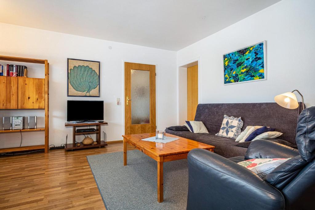 a living room with a couch and a coffee table at Adlerhorst in Wangen