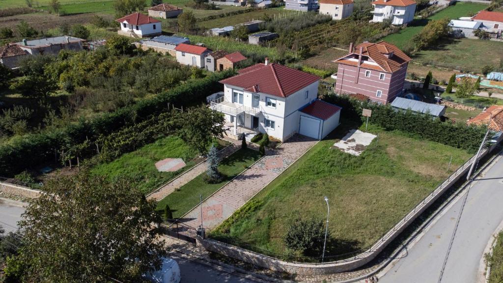 an aerial view of a white house on a hill at Vila Kabashi in Korçë