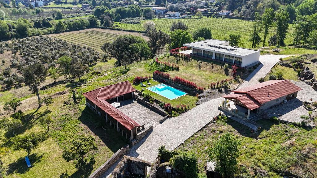 an aerial view of a house with a swimming pool at Quinta da Bela Vista do Lima in Ponte de Lima