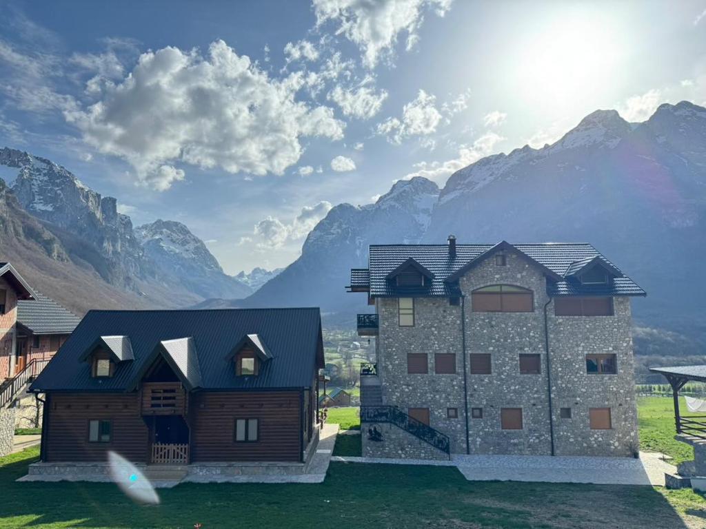 a rendering of a house with mountains in the background at Moonlight House in Vusanje