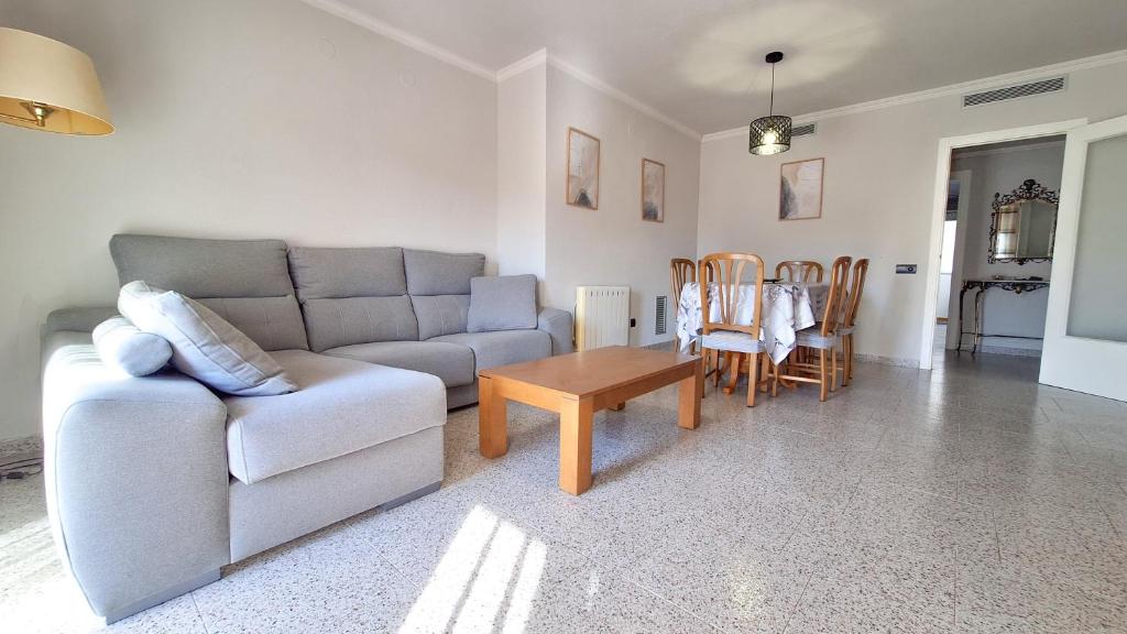 a living room with a couch and a table at Casa García in L'Aldea