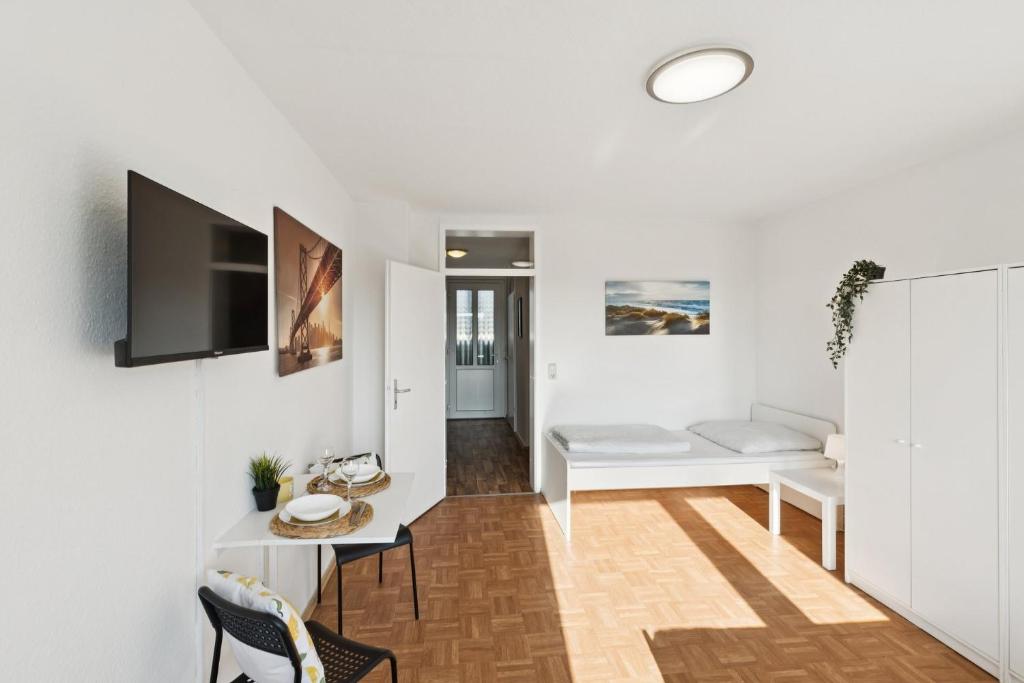 a living room with a couch and a table at Apartment mit Balkon in Lünen in Lünen