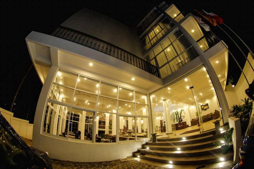 a large building with stairs in front of it at night at Tangalle - Sole Luna Resort & Spa in Tangalle