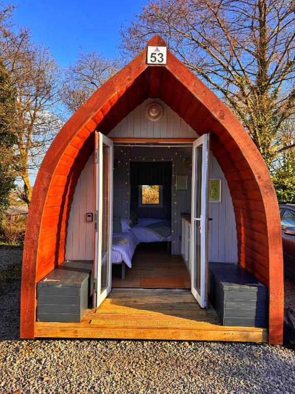a small tent with a bed in it at Little Green Glamping Pod in Narberth