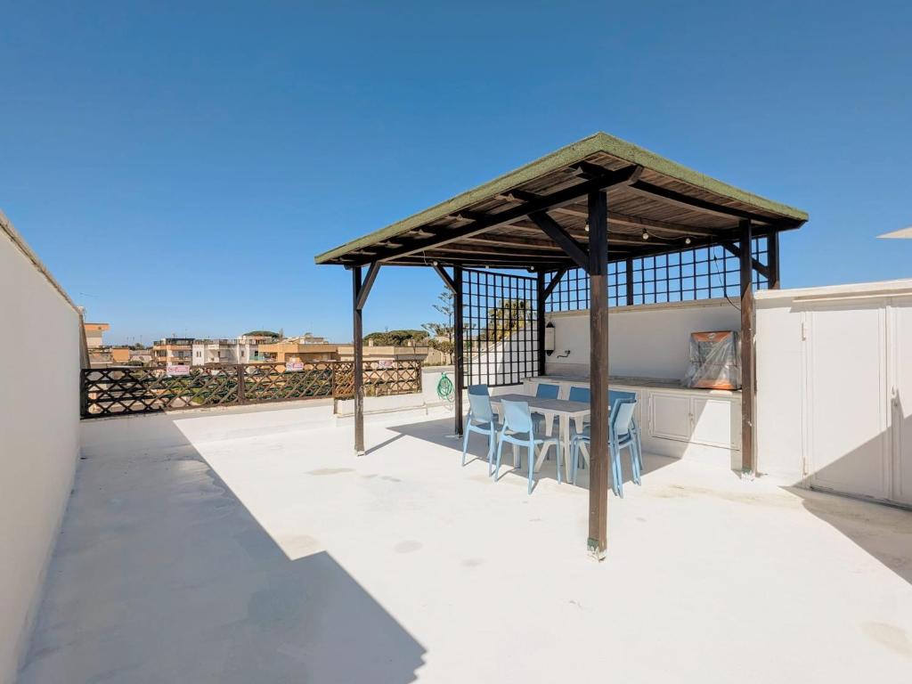 a gazebo on the roof of a house at Domus Caelestia in Anzio