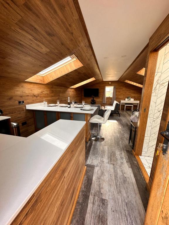 a large room with wooden walls and wooden floors at The Loft in Burnley