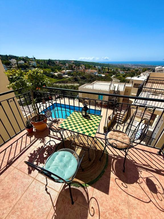 a balcony with a view of a swimming pool at Tala Panorama View in Tala