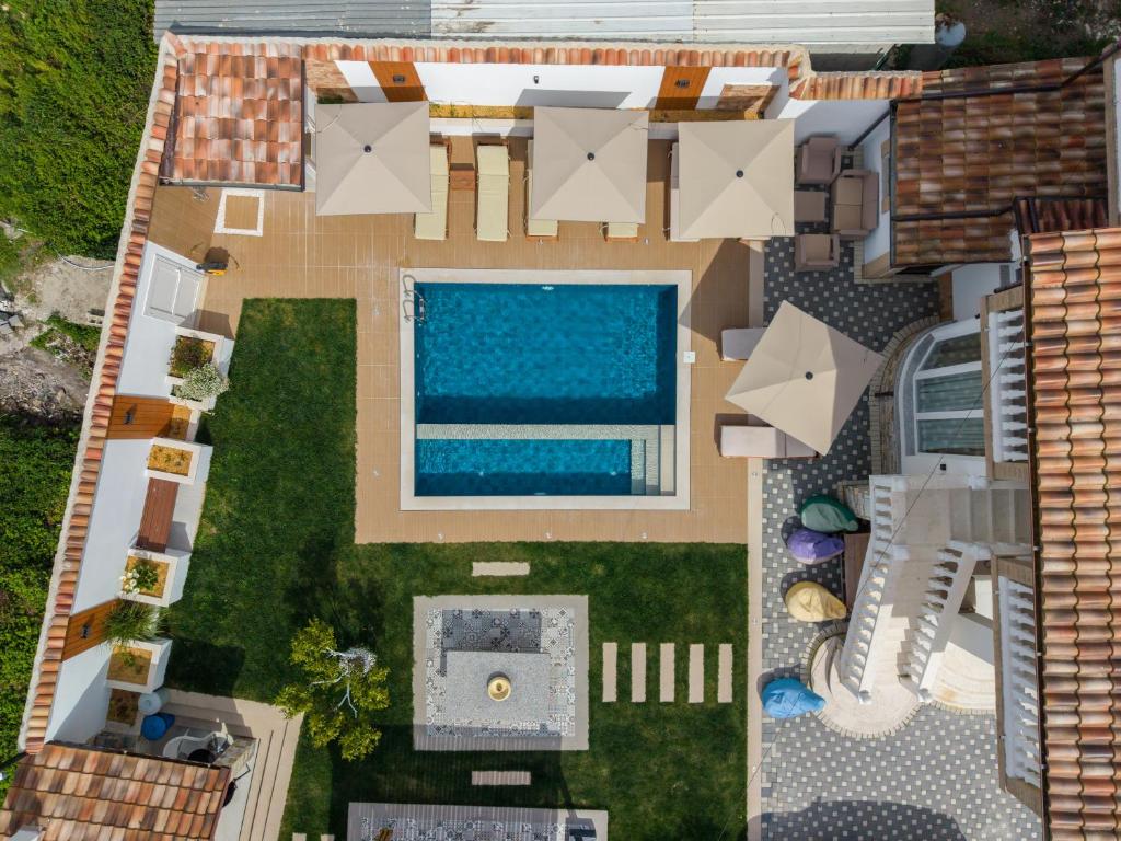 an aerial view of a house with a swimming pool at Villa Lejzo - Swimming Pool in Berat