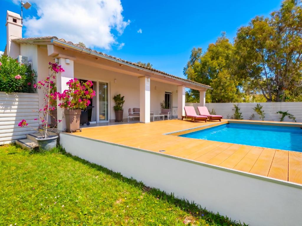 a villa with a swimming pool and a house at Villa Sunlight Sidari with private pool by DadoVillas in Sidari