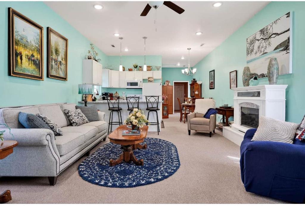 a living room with a couch and a table at Center Hill Cottage in Smithville