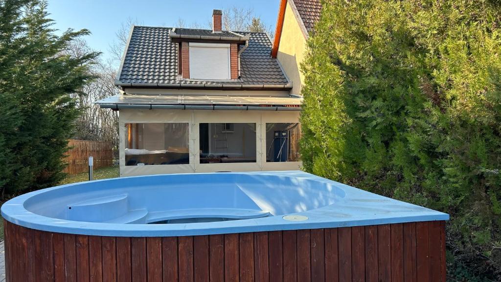 a large hot tub in front of a house at ReZa111 in Békésszentandrás