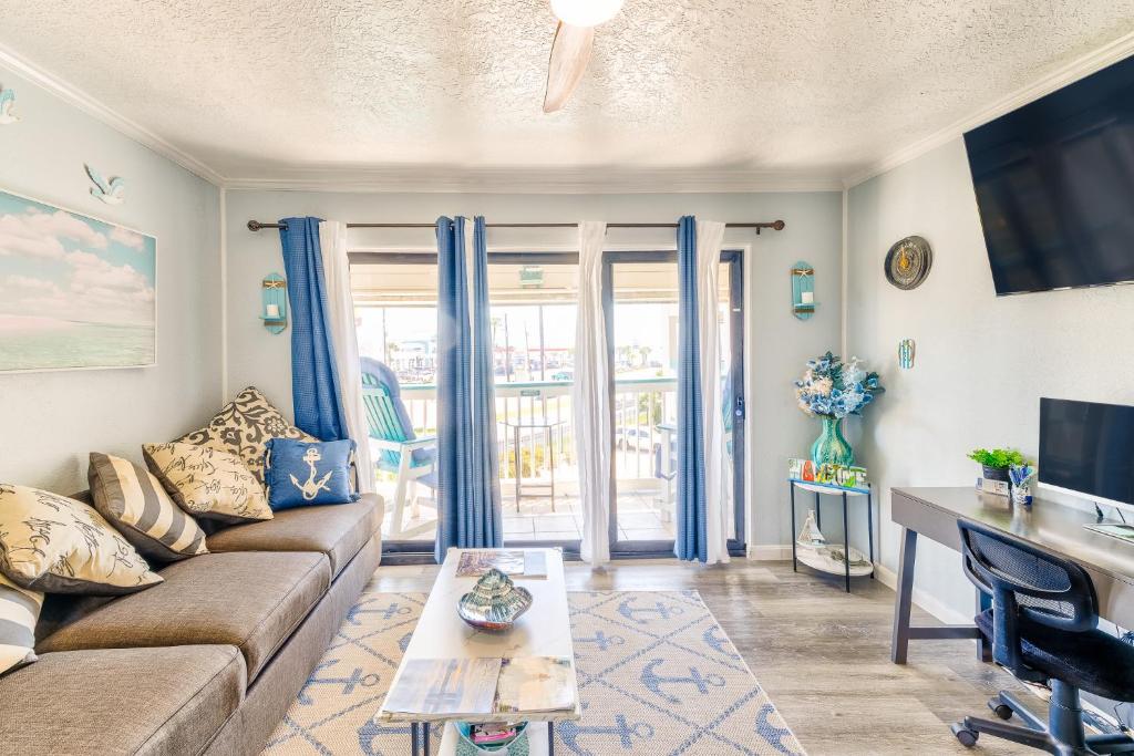 a living room with a couch and a table at Casa Del Mar 231 - Ocean View Family Retreat on Seawall in Galveston