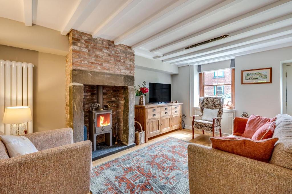 a living room with two couches and a fireplace at 3 Bed in Belper oc-dcbobb in Belper