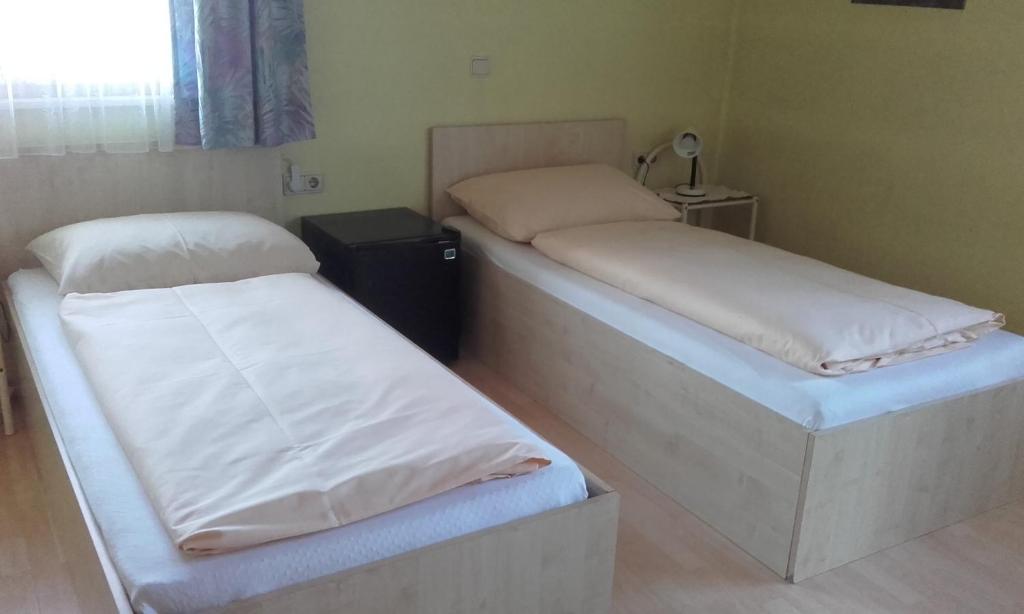 Postel nebo postele na pokoji v ubytování Gasthaus Bethlehem