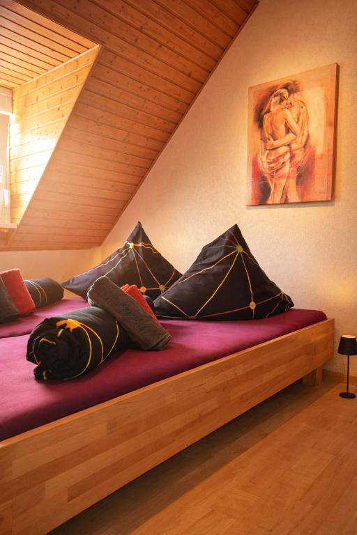 a bed with pillows on it in a room at Holiday Rhein 5 in Boppard