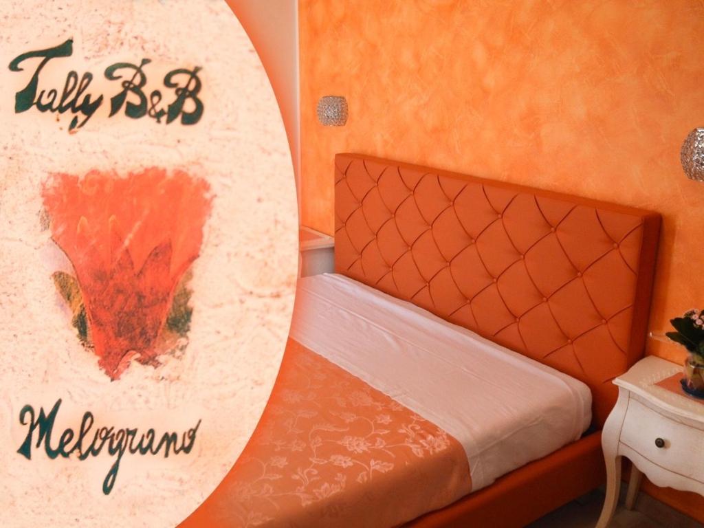 a bedroom with a bed with a surfboard on the wall at B&B - TallyHo in Salve