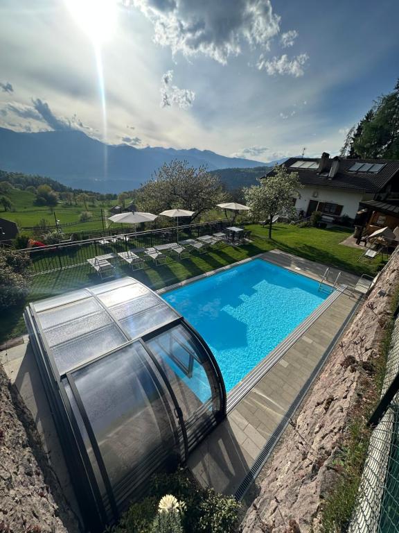 an image of a swimming pool in a house at Alpenrose in Meltina