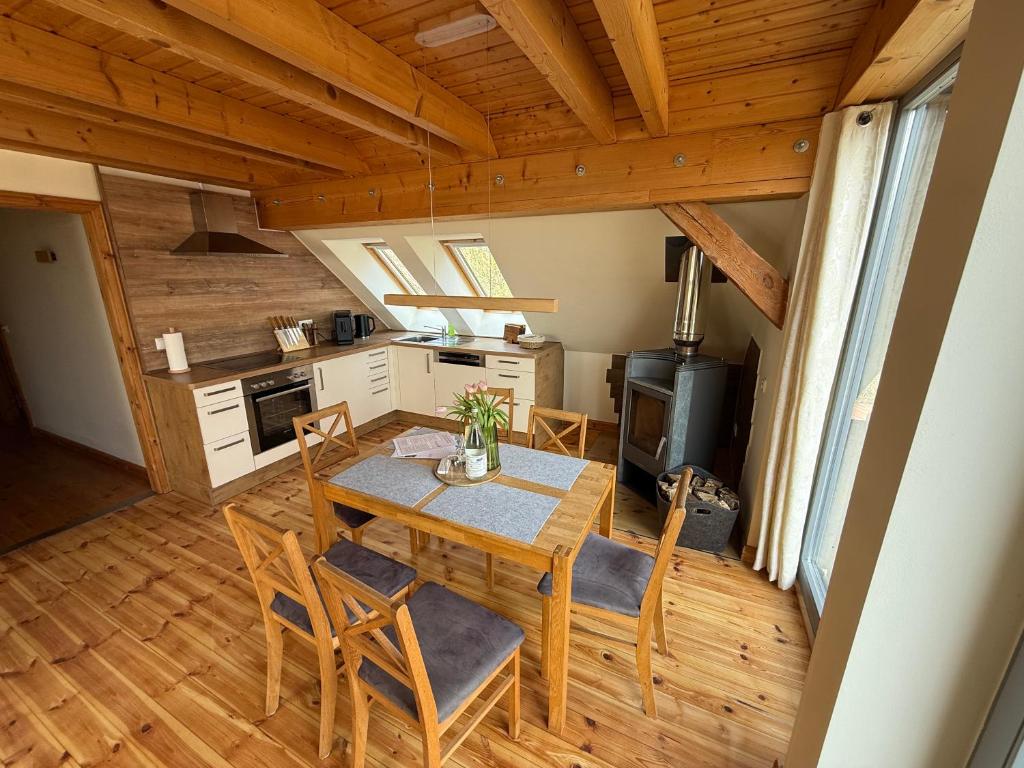 a kitchen and dining room with a table and chairs at Forsthaus Boberow in Rheinsberg