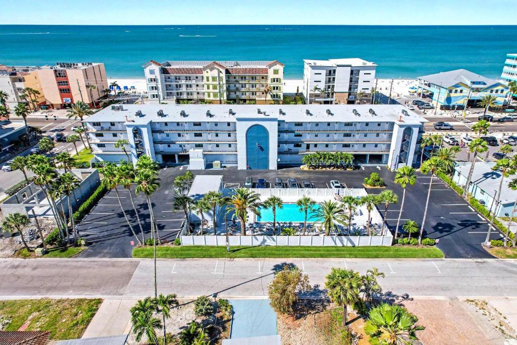 an aerial view of a hotel with the ocean in the background at Madeira Place 205 in St. Pete Beach