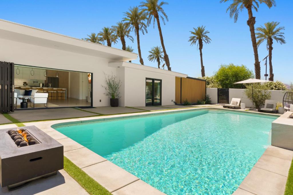 a swimming pool in the backyard of a house at Private Pool Escape Casita Mini Golf 4BR in Indio