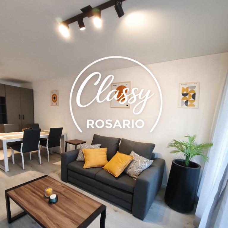 a living room with a couch and a table at Classy Rosario Centro in Rosario