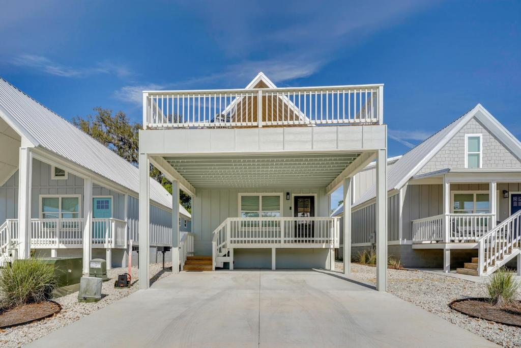 a house with a balcony on top of it at Brand New Home in Steinhatchee with Rooftop Deck! in Jena