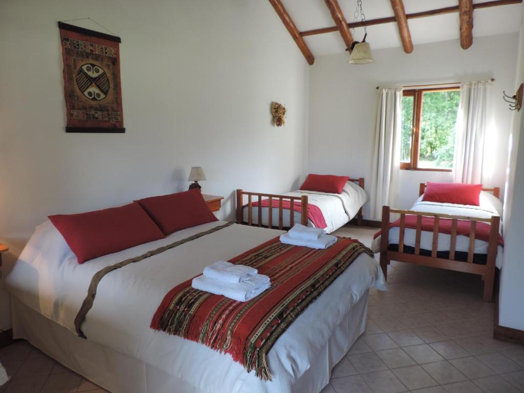 Postel nebo postele na pokoji v ubytování Hosteria El Hoyo