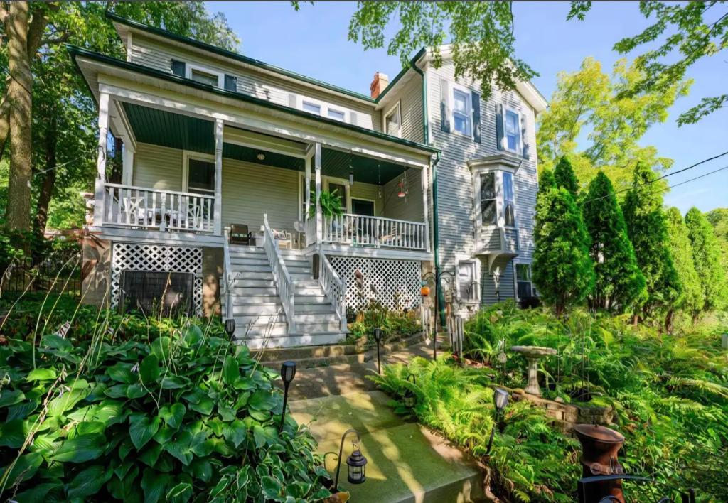 an old house with a garden in front of it at Avery House Bed & Breakfast in Galena