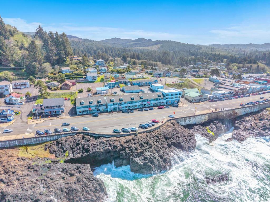 an aerial view of a town with a bridge over water at SeaQuell in Depoe Bay