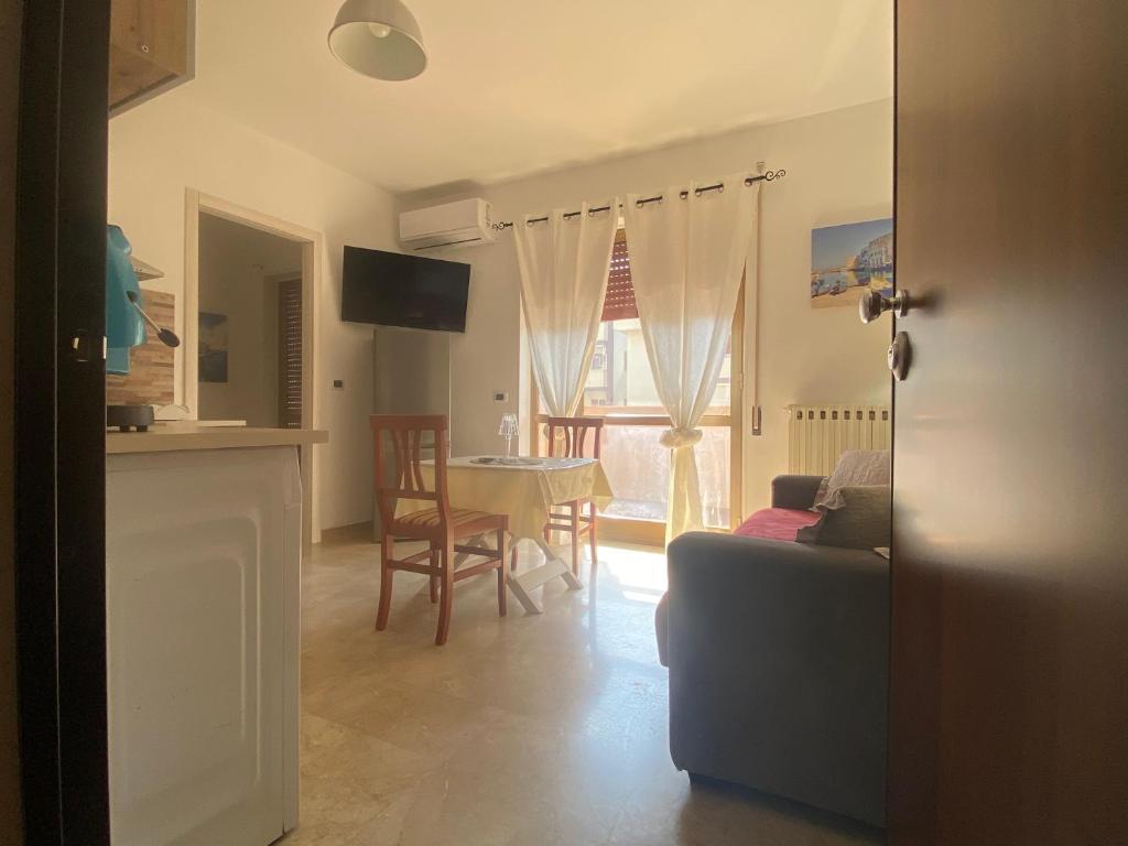 a living room with a couch and a table at Near Sea in Monopoli