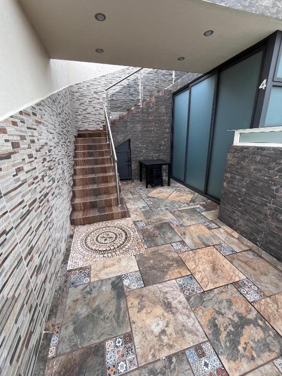 a staircase in a building with a tile floor at Casa tequila club jacuzzi 4 in Arandas