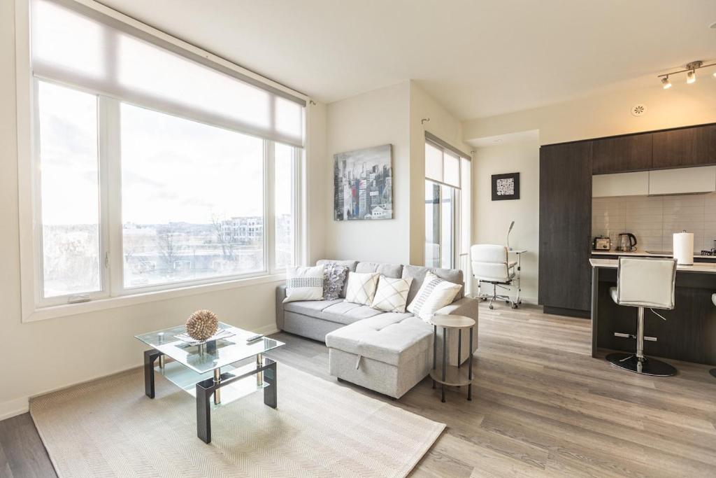 a living room with a couch and a table at Bisco Hill in Richmond Hill