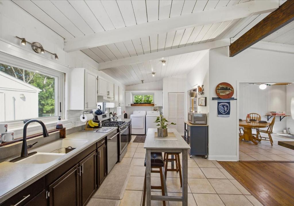 a large kitchen with a sink and a counter at Bruno's Landing in Kansas City